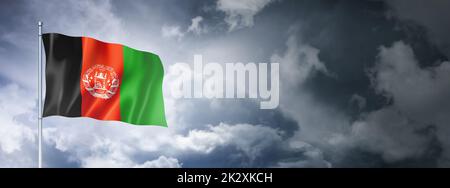 Afghan flag on a cloudy sky Stock Photo