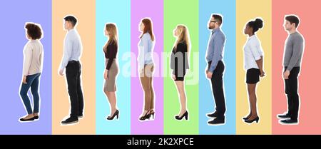 Group Of College Students Standing In Row Against White Background Stock Photo