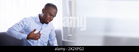 Man Suffering From Chest Pain Stock Photo