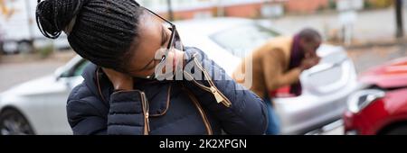 Woman Suffering From Neck Pain After Car Accident Stock Photo