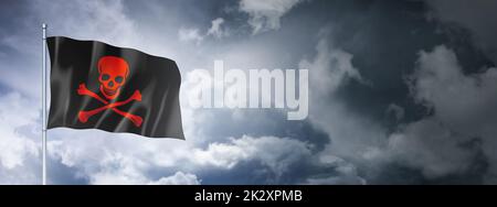 Pirate flag, Jolly Roger on a cloudy sky Stock Photo