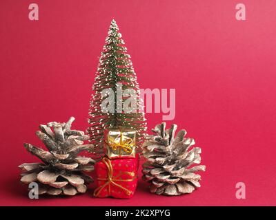 Christmas decoration with pine cones and gift boxes Stock Photo