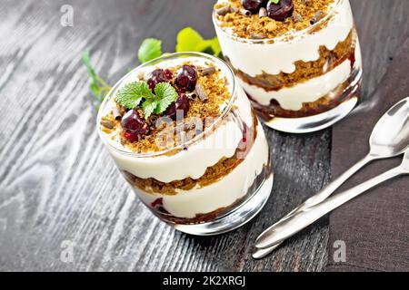 Dessert Black Forest in two glasses on dark board Stock Photo