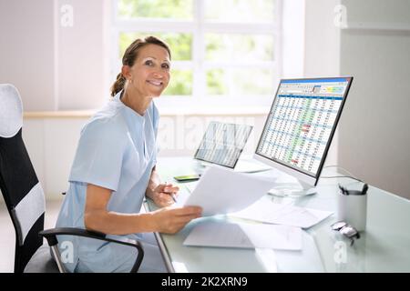 Medical Bill Codes And Spreadsheet Data Stock Photo