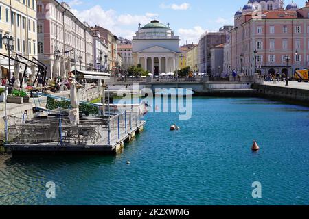 TRIESTE, ITALY - APRIL 24, 2022: Gran Canal with Church of Sant'Antonio Taumaturgo on the background in Trieste, Italy Stock Photo