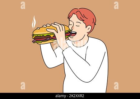 Hungry man eating burger Stock Photo