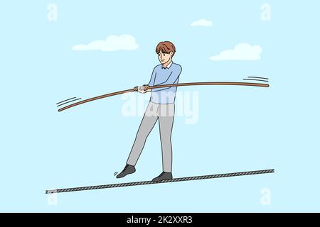 Man walking on thin rope balancing Stock Photo