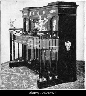 An upright pedal piano of the 19th century. Illustration of the 19th century. White background. Stock Photo