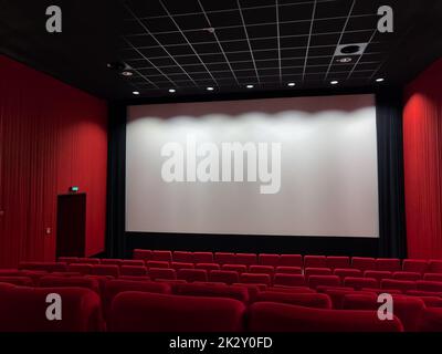 Cinema Screen  And Red Seats. Empty Screening Theater Stock Photo