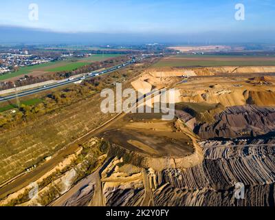 Mining equipment in a brown coal open pit mine near Garzweiler, Germany. Aerial View Stock Photo