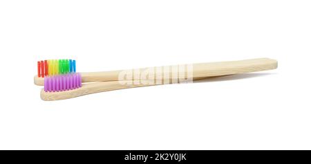 Bamboo toothbrushes on a white isolated background Stock Photo