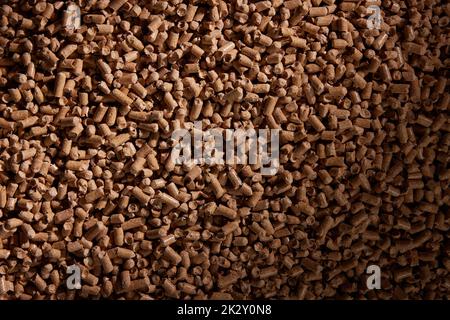 Textured background of heap of fuel pellets Stock Photo