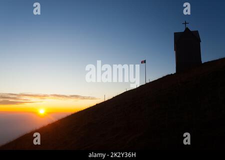 Dawn at the little church, mount Grappa landscape, Italy Stock Photo