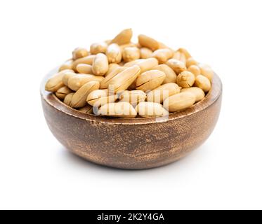 Roasted peeled peanuts in bowl isolated on white background. Stock Photo
