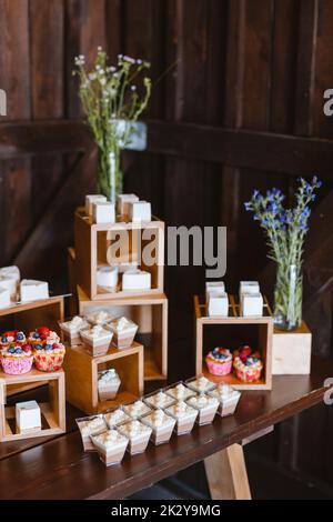 Candy bar. Festively decorated buffet table for guests. A stand with a variety of desserts for celebrating a party Stock Photo