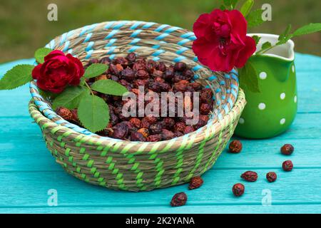 Many rose hips in a basket Stock Photo