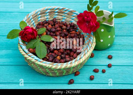 Many rose hips in a basket Stock Photo