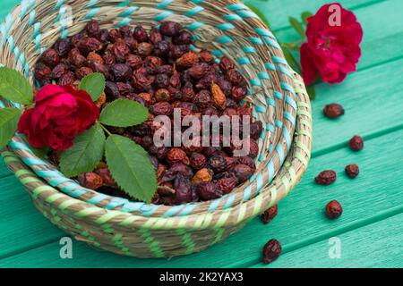 Many rose hips in a basket Stock Photo