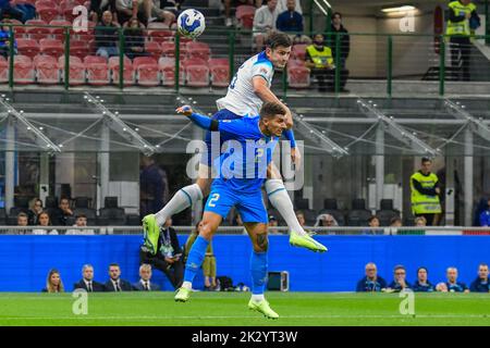 Milan, Italy. 23rd Sep, 2022. header of England's Harry Maguire against Italy's Giovanni Di Lorenzo during Italy vs England, football UEFA Nations League match in Milan, Italy, September 23 2022 Credit: Independent Photo Agency/Alamy Live News Stock Photo