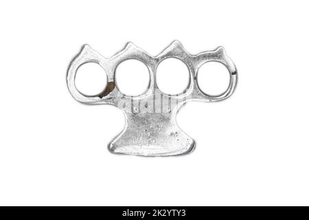 Brass knuckles and diamonds on a white background, top view. Concept of  looting. A metal guard worn over the knuckles in fighting, especially to  increase the effect of the blows. Stock Photo