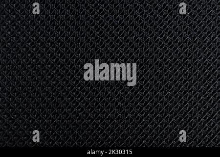 Close up of black synthetic textured fabric with a rhombus pattern used to make blinds. Template design or polyester material abstract background Stock Photo