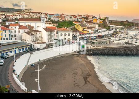 City view of the public beach called the Praia de Angra do Heroismo at sunset in the historic city centre of Angra do Heroismo, Terceira Island, Azores, Portugal. Stock Photo