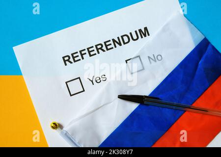 Referendum ballot paper, Russian flag and pen on table in Ukraine, top view. Concept of referendum on joining Russia, war in Ukraine, voting in Donets Stock Photo