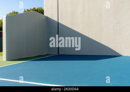 Example of an outside American Handball courts with concrete wall, located at a park or school. Stock Photo