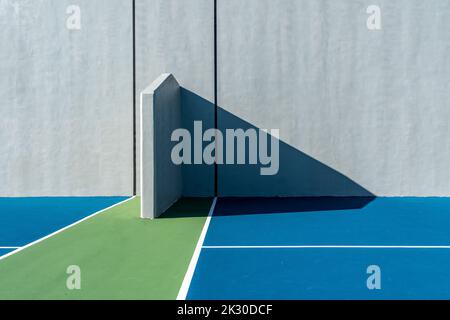 Example of an outside American Handball courts with concrete wall, located at a park or school. Stock Photo