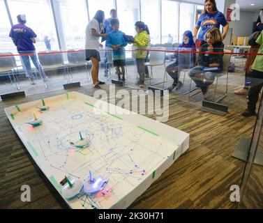 Vancouver, Canada. 23rd Sep, 2022. Children try to program the movement of robots during the Tech-Up Showcase event at Science World in Vancouver, Canada, on Sept. 23, 2022. Credit: Liang Sen/Xinhua/Alamy Live News Stock Photo