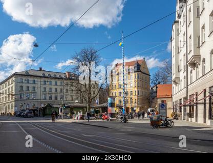 Germany, Bavaria, Munich, Power lines hanging over street in front of Wiener Platz Stock Photo
