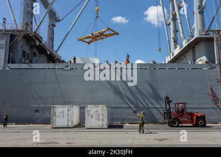 U.S. Marines with Marine Aviation Logistics Squadrons (MALS) unload cargo from the Military Sealift Command aviation-logistics support ship SS Wright (T-AVB 3) at the Port of Morehead City, North Carolina, Sept. 20, 2022. The SS Wright provides MALS with the capability to conduct intermediate aviation maintenance aboard the ship, which reduces the time required for maintenance during a deployment. The MALS are subordinate units of 2nd Marine Aircraft Wing, the Aviation Combat element of II Marine Expeditionary Force. (U.S. Marine Corps photo by Cpl. Adam Henke) Stock Photo