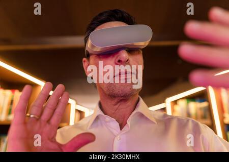 Businessman wearing modern virtual reality headset Stock Photo
