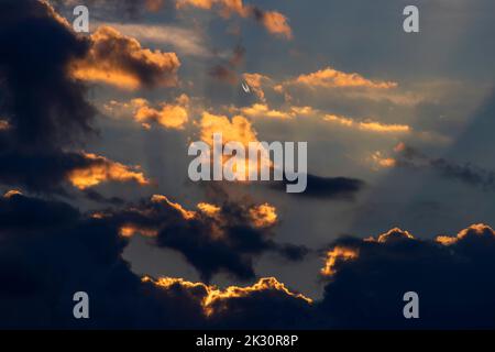 Clouds illuminated by setting sun Stock Photo