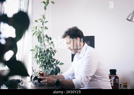Businessman working on tablet PC at office Stock Photo