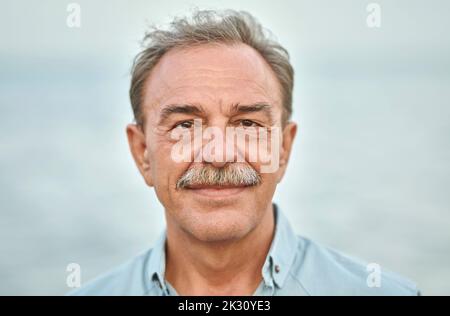 Smiling senior man with gray hair Stock Photo