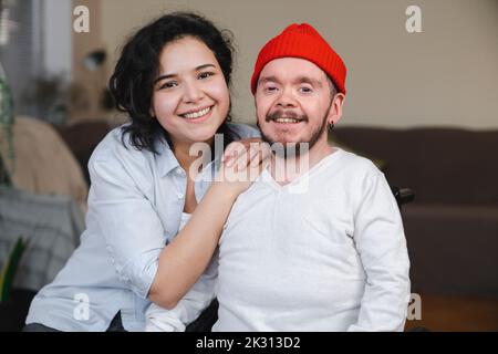 Smiling couple in living room at home Stock Photo