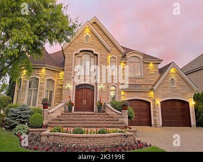 Luxury Home exterior at sunset Stock Photo