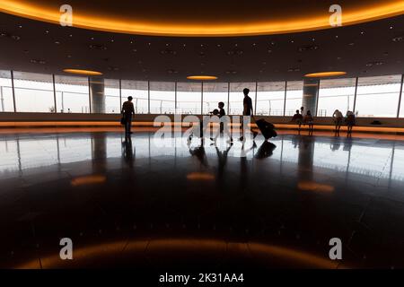 Silhouettes of travellers at Haneda International Airport Terminal, Tokyo, Japan Stock Photo