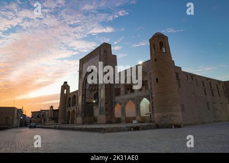 BUKHARA, UZBEKISTAN - SEPTEMBER 11, 2022: Ancient Abdulaziz Khan madrasah on the sunrise Stock Photo