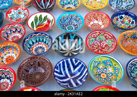 BUKHARA, UZBEKISTAN - SEPTEMBER 11, 2022: Multicolored bright bowls close up Stock Photo