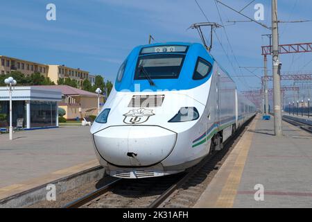 BUKHARA, UZBEKISTAN - SEPTEMBER 11, 2022: Locomotive of Talgo 250 'Afrosiyob' high-speed train  close-up on a sunny day Stock Photo