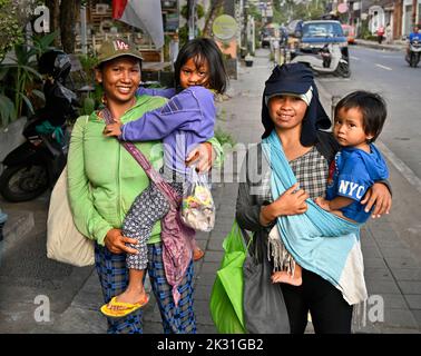Bali, Indonesia - September 18, 2022; Mothers with their children at Saturday Ubud Market, Bali Indonesia Stock Photo