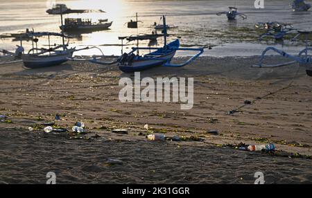 Plastic Bottle Pollution at low tide on Bali Beaches, Indonesia Stock Photo