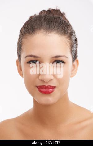 Sassy in red. a beautiful young woman with red lips isolated on white. Stock Photo