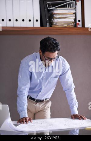 Hes ready for whatever the business world throws at him. a handsome young businessman in his office. Stock Photo