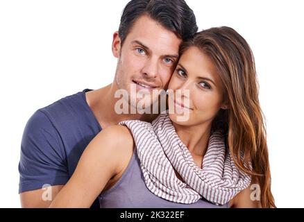 Portrait of the perfect couple. Studio portrait of a loving young couple isolated on white. Stock Photo