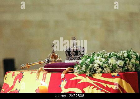 The crown and ceptre on top of the coffin of Queen Elizabeth II during the lying-in-state period at Westminster Hall, London, England, UK Stock Photo