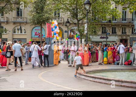 Paris, france. August 2022. Hare Krishna dancing and singing on the Boulevard de Saint Michel in Paris. High quality photo Stock Photo