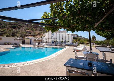 Ios, Greece - September 13, 2022 : Panoramic view of a beautiful luxury hotel with swimming pool,  sun beds and sun umbrellas in Ios Greece Stock Photo
